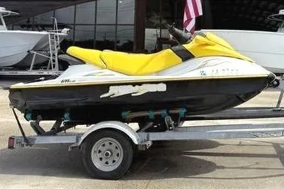 Slide: The Image of 2005 Sea-Doo GTI LE jet ski with yellow seat on trailer. - 3