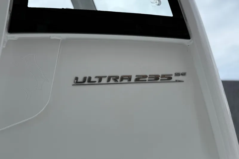 Slide: The Image of 2026 Sea Hunt Ultra 235 SE boat emblem on white surface. - 22