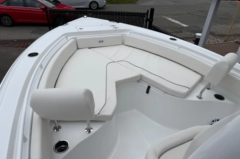 Slide: The Image of 2026 Sea Hunt Ultra 235 SE boat with white cushioned seating area. - 4