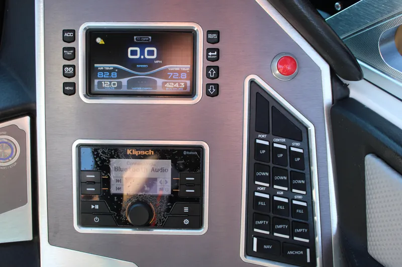 Slide: The Image of Control panel of a 2018 MasterCraft XT22 boat with digital displays and buttons. - 21