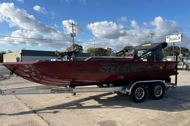 The Image of 2026 SeaArk Easy 200 boat on trailer, parked outdoors under a blue sky. - 0