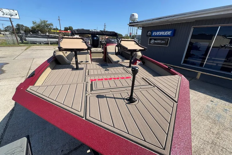 Slide: The Image of 2026 SeaArk Easy 200 boat with spacious deck, parked outside dealership. - 10