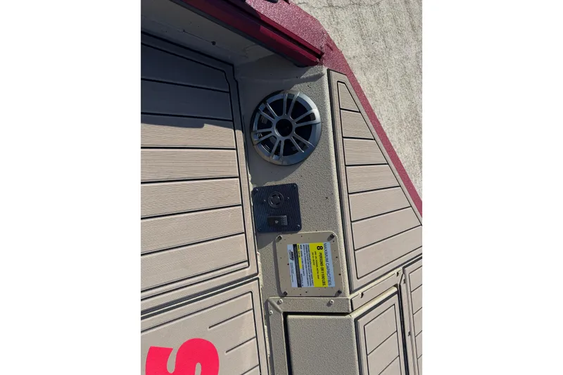 Slide: The Image of Deck of 2026 SeaArk Easy 200 boat with speaker and safety label. - 14