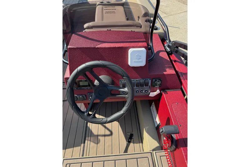 Slide: The Image of Steering console of 2026 SeaArk Easy 200 boat with red dashboard and controls. - 16