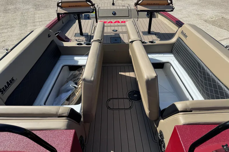 Slide: The Image of 2026 SeaArk Easy 200 boat interior with tan seating and storage compartments. - 20