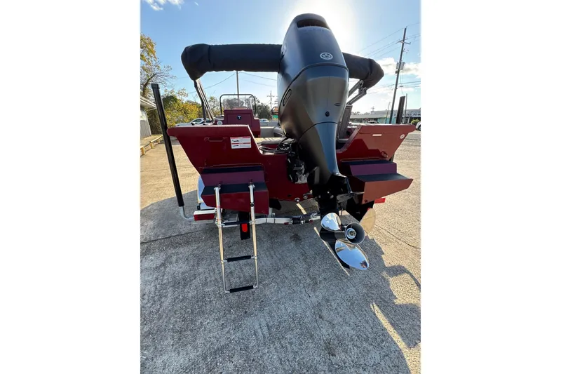 Slide: The Image of 2026 SeaArk Easy 200 boat rear view with outboard motor and ladder. - 5