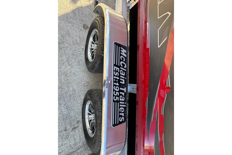 Slide: The Image of Trailer with McClain Trailers logo, supporting a 2026 SeaArk Easy 200 boat. - 7
