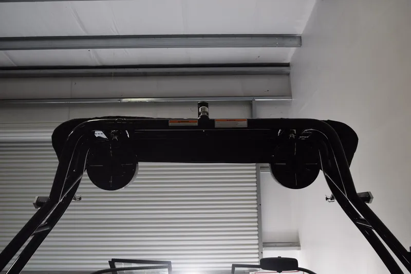 Slide: The Image of 2026 Moomba Craz boat tower in a garage setting, viewed from below. - 4