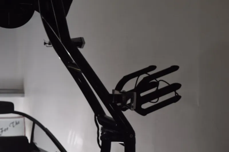 Slide: The Image of 2026 Moomba Craz boat tower with wakeboard rack in a dimly lit setting. - 5