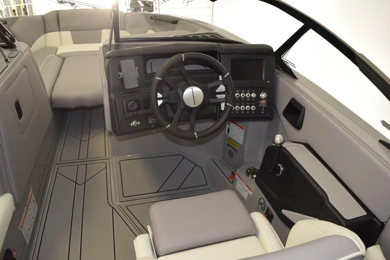 Slide: The Image of 2026 Moomba Craz boat interior with modern dashboard and steering wheel. - 7