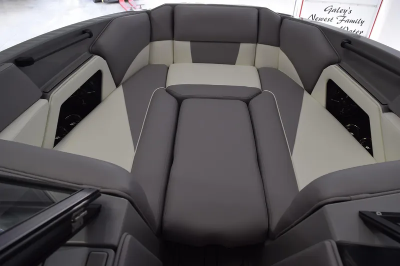 Slide: The Image of 2026 Moomba Craz boat interior with gray and white cushioned seating. - 9