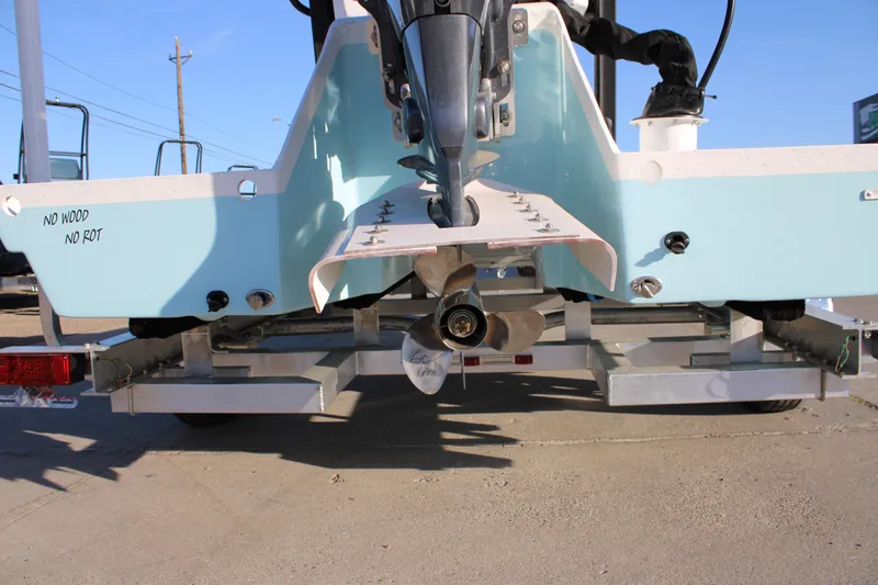 Slide: The Image of 2026 Freedom Boats Chiquita on trailer, showcasing propeller and "No Wood No Rot" feature. - 15