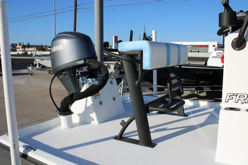 Slide: The Image of 2026 Freedom Boats Chiquita with Yamaha motor, featuring a blue and white seat. - 5