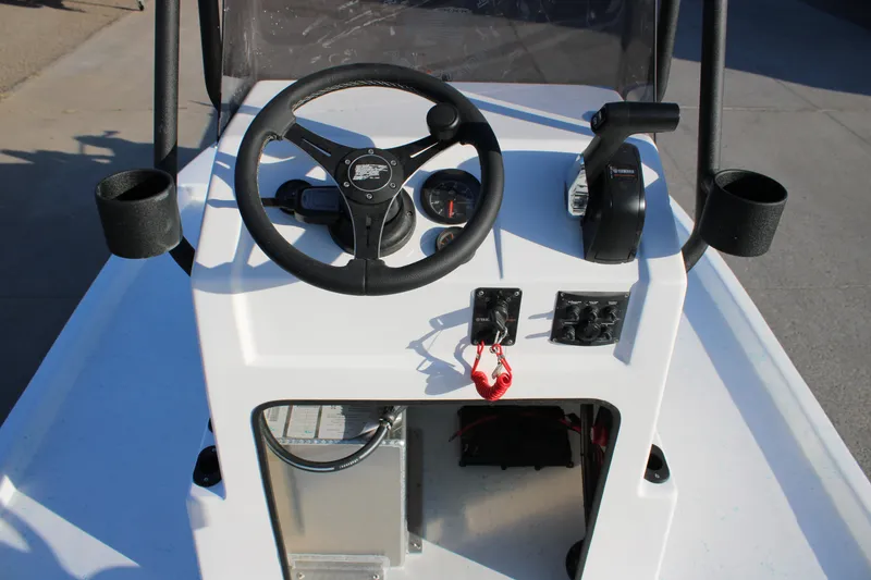 Slide: The Image of 2026 Freedom Boats Chiquita console with steering wheel and controls. - 13