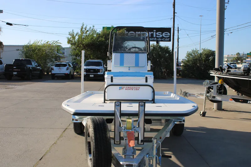 Slide: The Image of 2026 Freedom Boats Chiquita on trailer in parking lot, front view. - 17