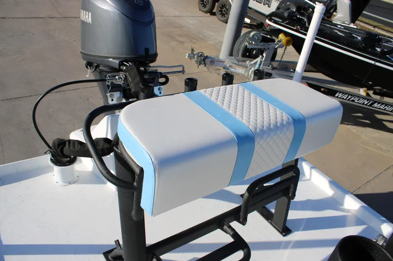 Slide: The Image of 2026 Freedom Boats Chiquita with Yamaha motor and cushioned seat detail. - 7