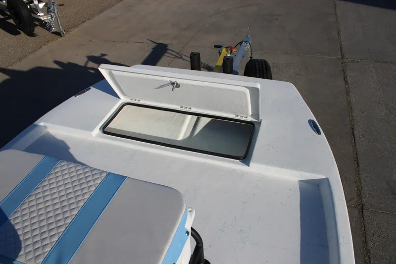 Slide: The Image of 2026 Freedom Boats Chiquita with open storage compartment on deck. - 9