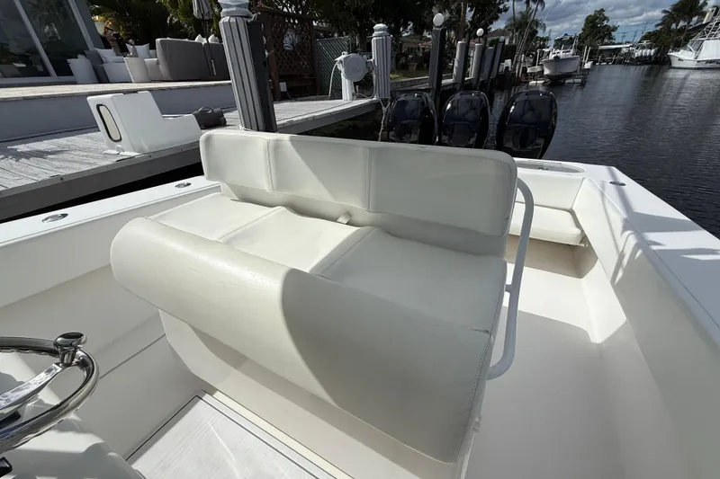 Slide: The Image of White seating on a 2010 SeaHunter 40 boat, docked by a waterfront. - 27