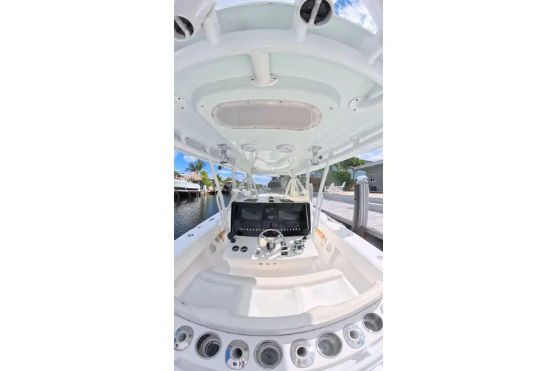Slide: The Image of 2010 SeaHunter 40 boat helm with modern controls and waterfront view. - 4