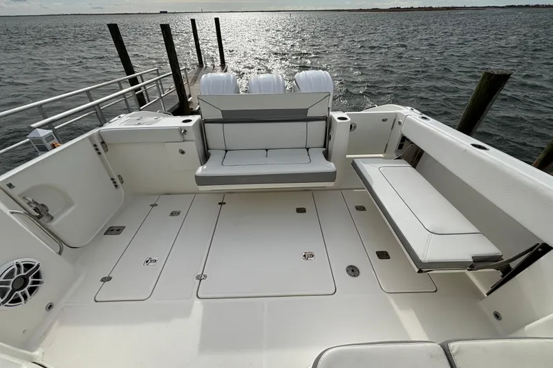 Slide: The Image of 2022 Pursuit DC 365 Dual Console boat with spacious seating and ocean view. - 15