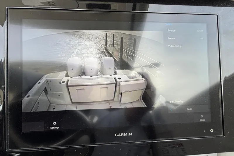 Slide: The Image of Garmin display showing rear view of 2022 Pursuit DC 365 Dual Console boat. - 23