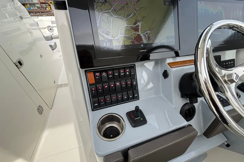 Slide: The Image of 2022 Pursuit DC 365 Dual Console helm with Garmin display and control panel. - 24
