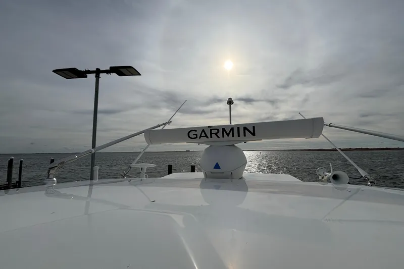 Slide: The Image of 2022 Pursuit DC 365 Dual Console boat with Garmin radar on a sunny day at sea. - 43