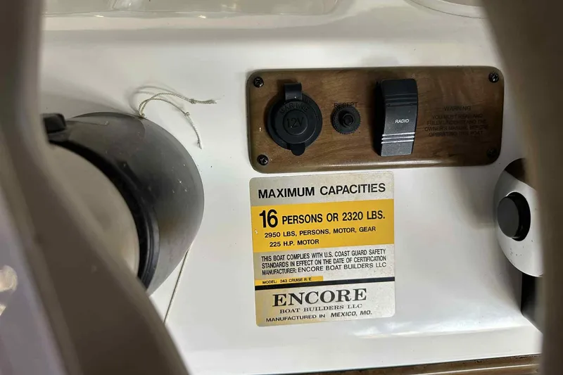 Slide: The Image of 2011 Bentley Pontoons 240/243 Cruise capacity label, 16 persons or 2320 lbs, safety compliance. - 14