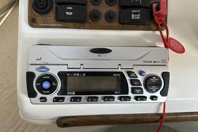 Slide: The Image of 2011 Bentley Pontoons 240/243 Cruise dashboard with Jensen audio system and controls. - 16