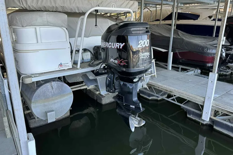 Slide: The Image of 2011 Bentley Pontoons 240/243 Cruise with Mercury 200 engine docked in marina. - 9