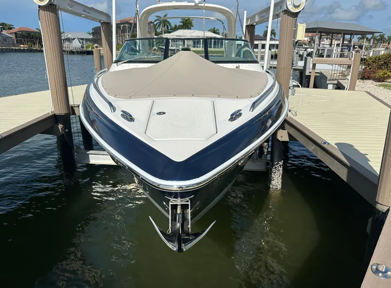 Slide: The Image of 2015 Formula 310 Bowrider docked at marina, front view. - 1