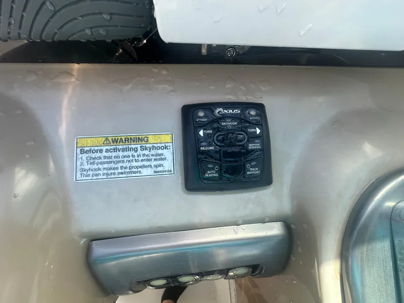 Slide: The Image of Control panel on 2015 Formula 310 Bowrider boat with safety warning label. - 12