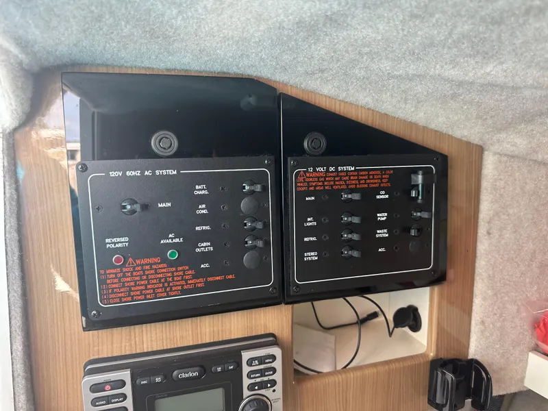 Slide: The Image of Control panel of a 2015 Formula 310 Bowrider boat, featuring electrical system switches. - 20