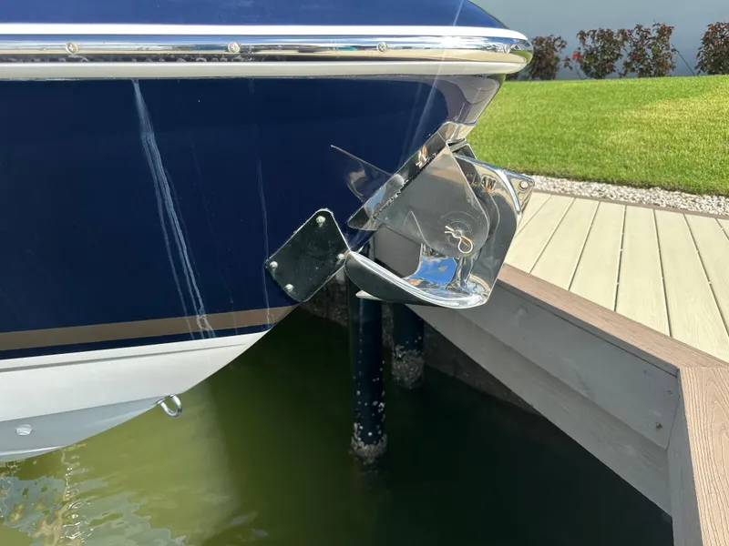 Slide: The Image of 2015 Formula 310 Bowrider boat anchored at dockside, close-up view. - 27