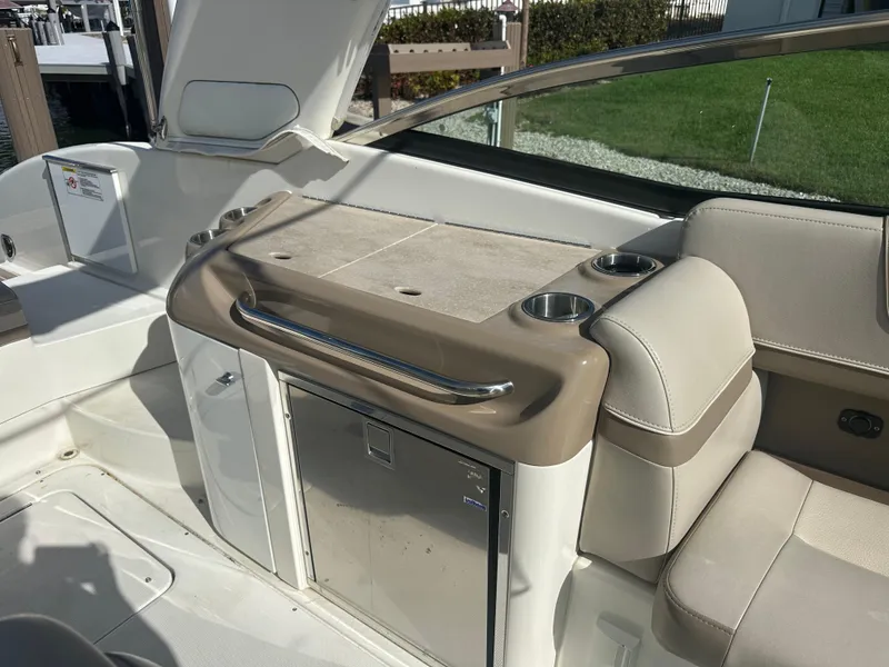 Slide: The Image of 2015 Formula 310 Bowrider interior with seating and storage area. - 6
