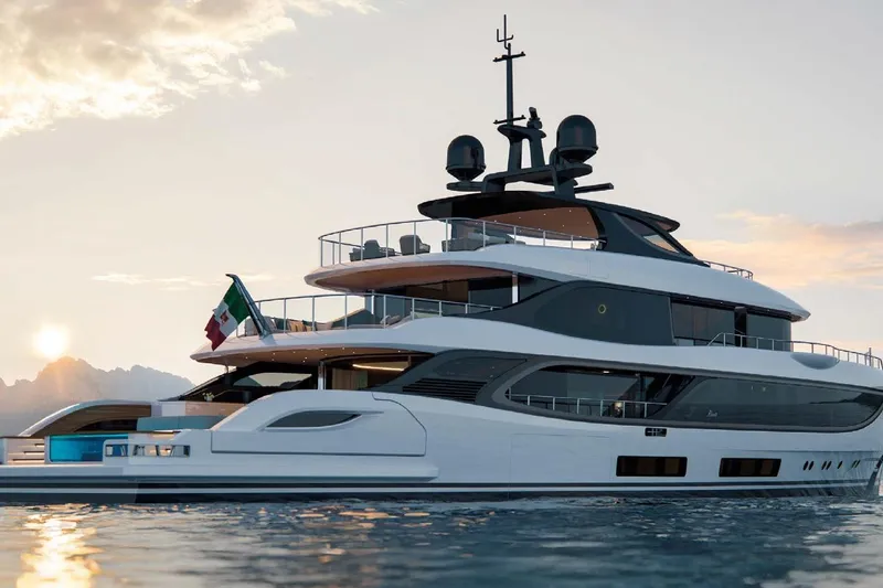 Slide: The Image of Luxurious 2028 Benetti Oasis 42M Co Ownership yacht at sunset on the water. - 3