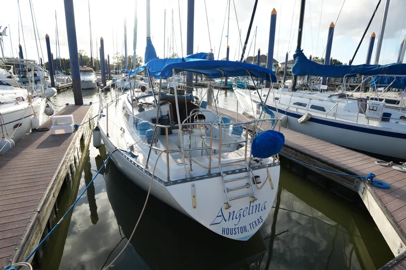 Slide: The Image of 1985 Ta Chiao 38 sailboat docked in marina, named "Angelina," Houston, Texas. - 1