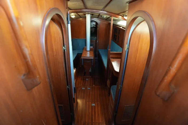 Slide: The Image of Interior of 1985 Ta Chiao 38 sailboat with wooden finish and cozy seating. - 14