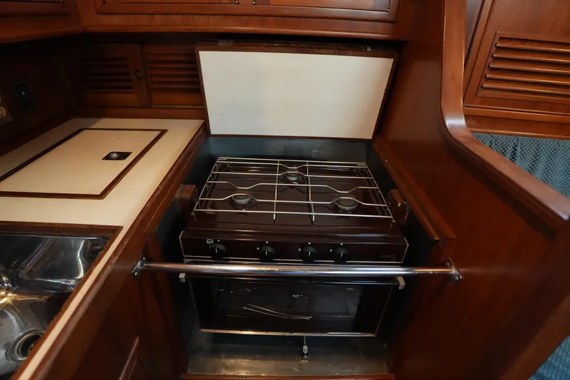 Slide: The Image of 1985 Ta Chiao 38 yacht kitchen with stove and wooden cabinetry. - 20