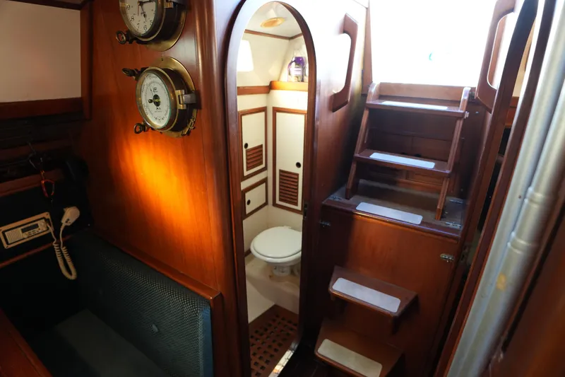 Slide: The Image of Interior of 1985 Ta Chiao 38 sailboat with wooden stairs and nautical instruments. - 24