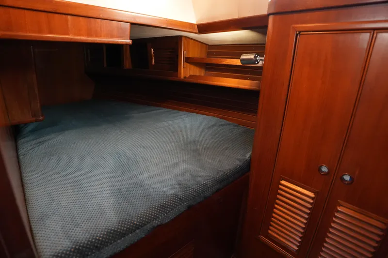 Slide: The Image of Cozy cabin interior of 1985 Ta Chiao 38 sailboat with wooden furnishings. - 27