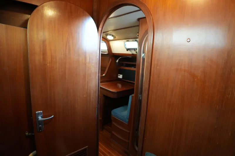 Slide: The Image of 1985 Ta Chiao 38 yacht interior with wooden doors and seating area. - 28