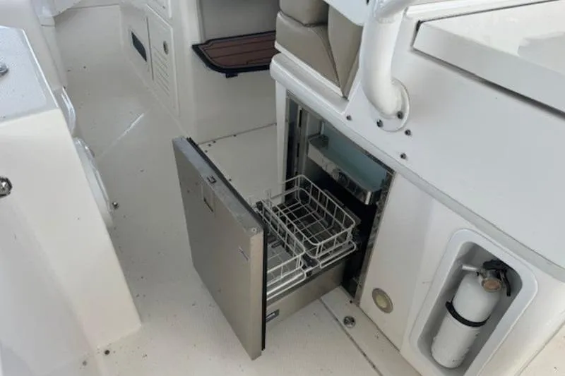 Slide: The Image of Open drawer in 2016 Everglades 360LXC boat interior, showcasing storage space. - 39