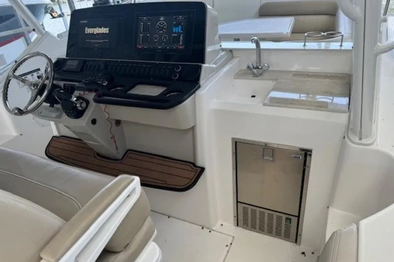 Slide: The Image of Interior of a 2016 Everglades 360LXC boat with steering console and sink. - 4