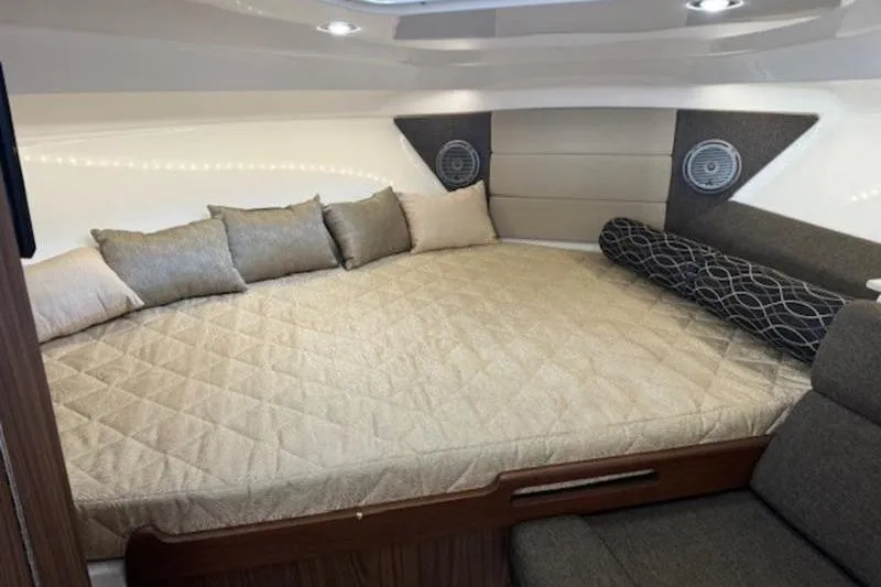 Slide: The Image of Luxurious cabin interior of 2016 Everglades 360LXC with plush bedding and modern design. - 49