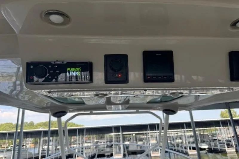 Slide: The Image of 2016 Everglades 360LXC boat dashboard with electronic controls and Fusion Link system. - 59