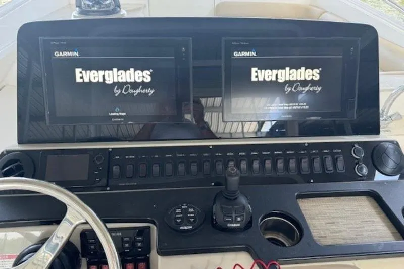 Slide: The Image of Control panel of 2016 Everglades 360LXC boat with dual Garmin displays. - 60