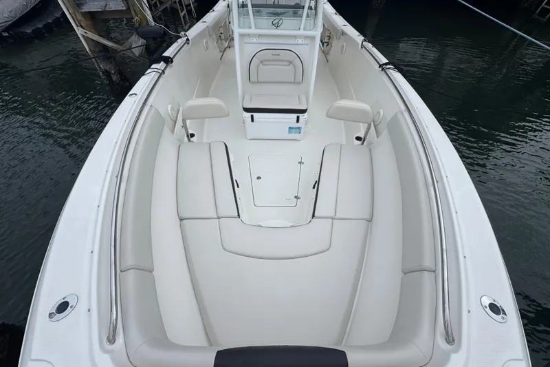 Slide: The Image of 2022 Sailfish 320 CC boat interior with spacious seating and sleek design. - 16