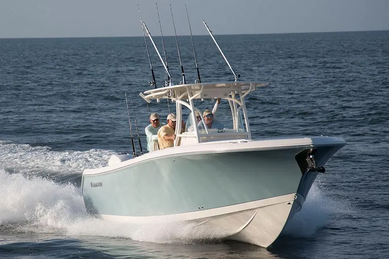 Slide: The Image of Manufacturer Provided Image: 2022 Sailfish 320 CC boat cruising on the ocean with three passengers. - 21