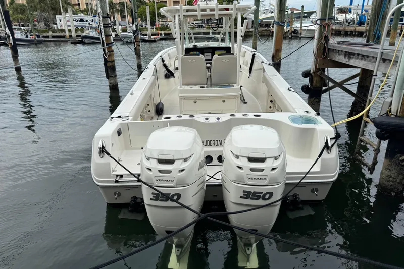 Slide: The Image of 2022 Sailfish 320 CC boat with dual 350 Verado engines docked at marina. - 3
